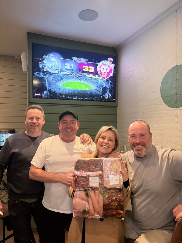 Regulars watching the footy with a Bells Meats prize pack