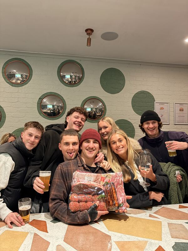 Group celebrating a Bells Meats prize pack win
