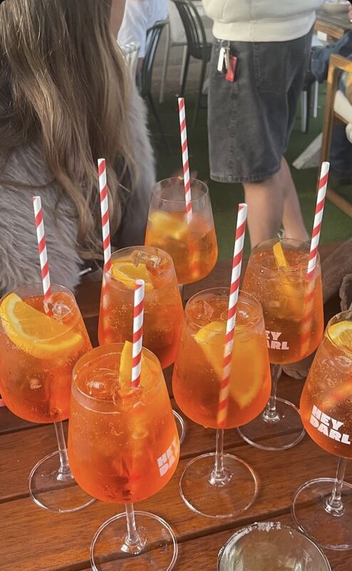 A row of Aperol spritz at Hey Darl