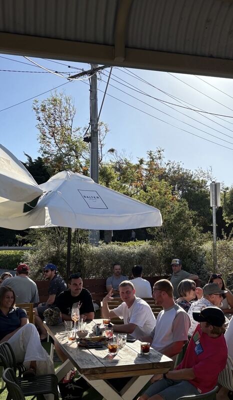 A sunny afternoon crowd at Hey Darl
